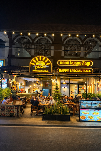 Happy Special Pizza restaurant at night on the Kampot riverfront